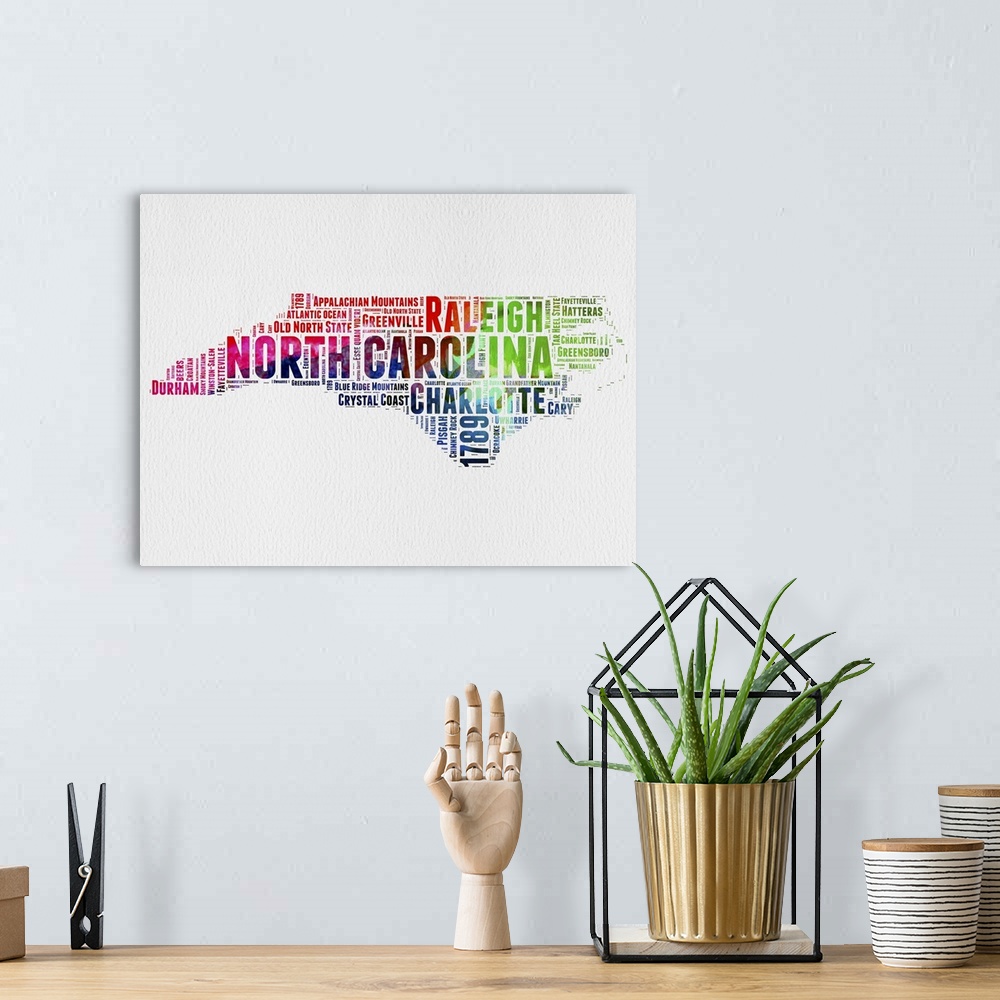 A bohemian room featuring Watercolor typography art map of the US state North Carolina.