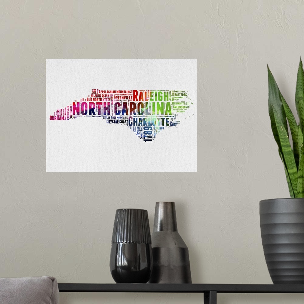 A modern room featuring Watercolor typography art map of the US state North Carolina.