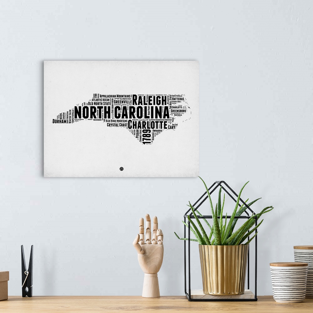 A bohemian room featuring Typography art map of the US state North Carolina.