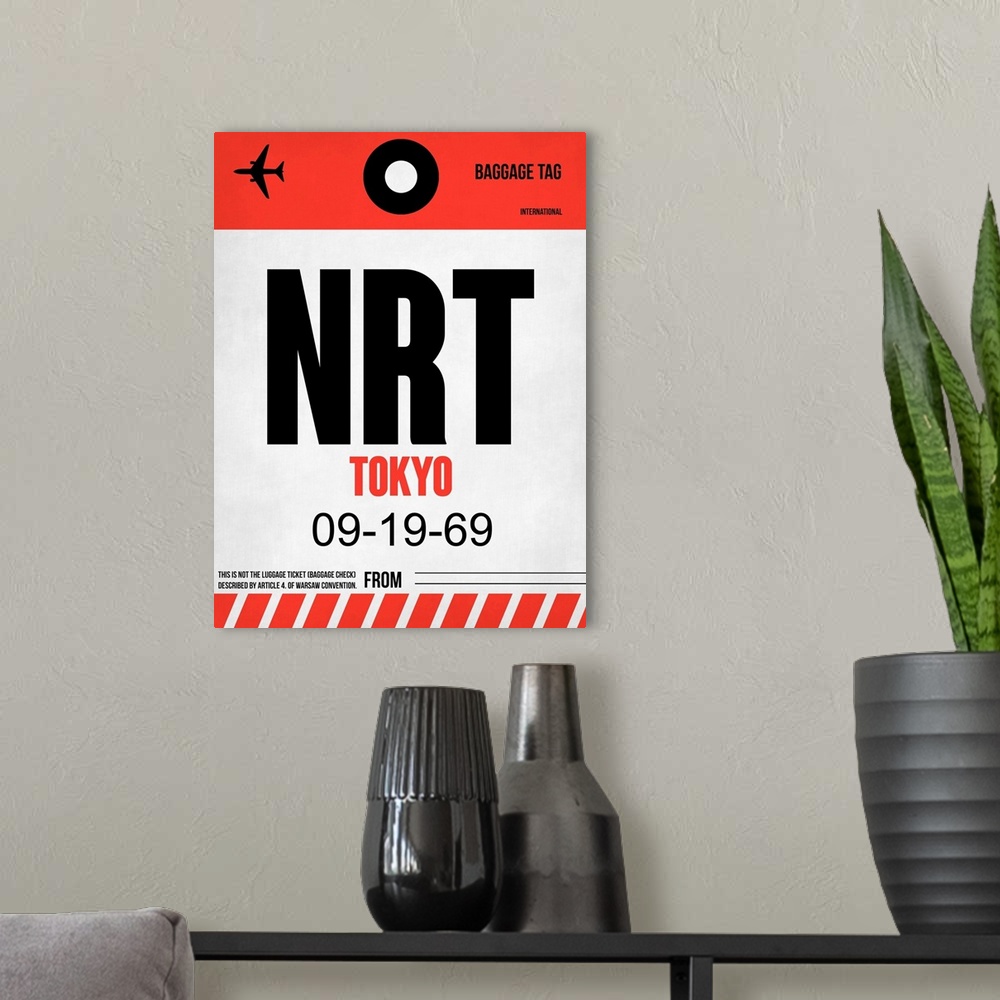 A modern room featuring NRT Tokyo Luggage Tag I