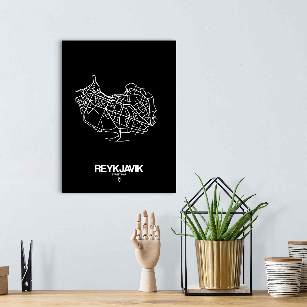 A bohemian room featuring Minimalist art map of the city streets of Reykjavik in black and white.