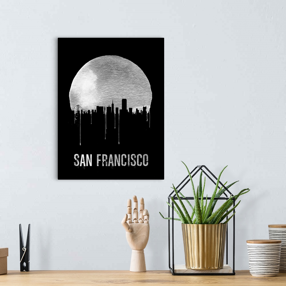 A bohemian room featuring Contemporary watercolor artwork of the San Francisco city skyline, in silhouette.