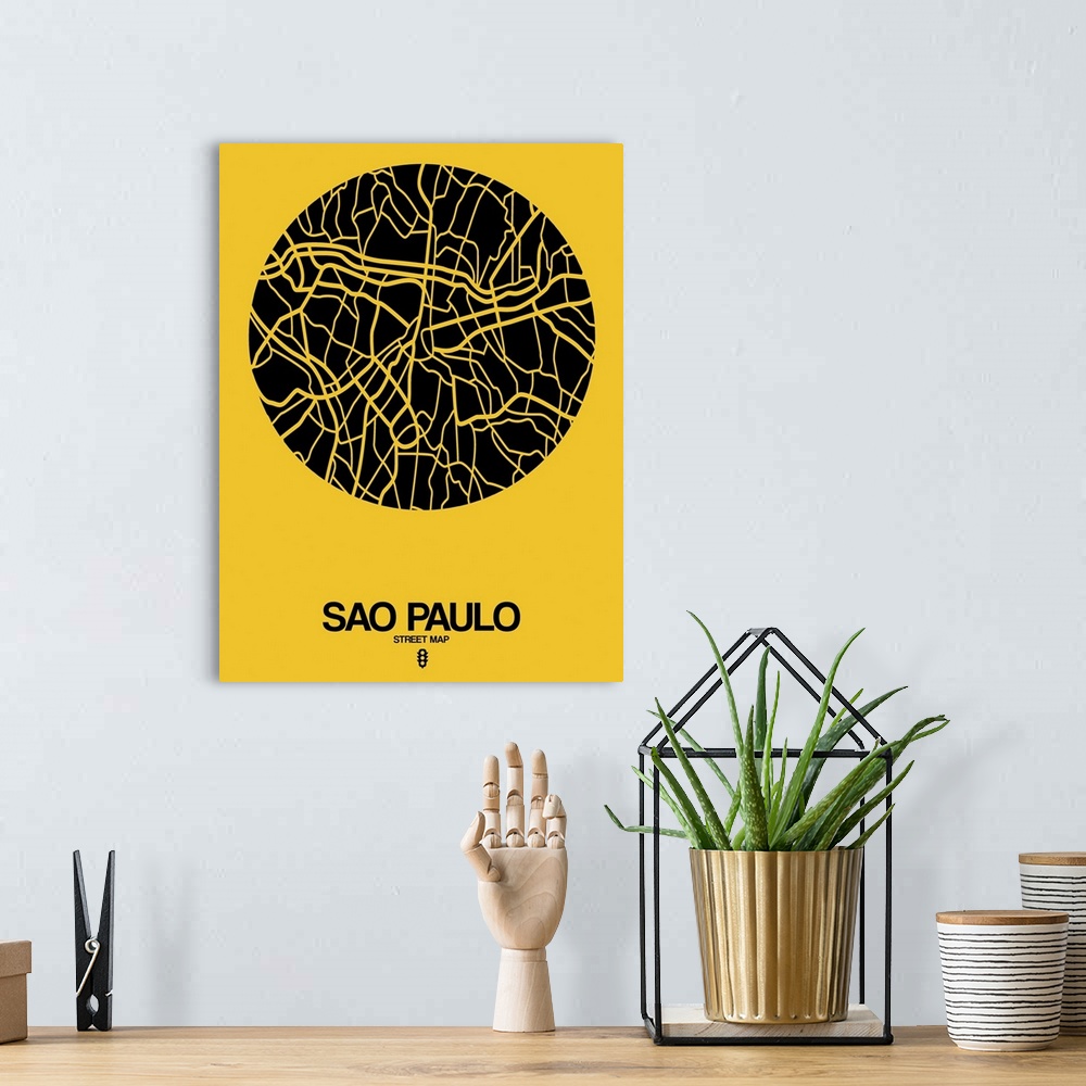 A bohemian room featuring Minimalist art map of the city streets of Sao Paulo in yellow and black.
