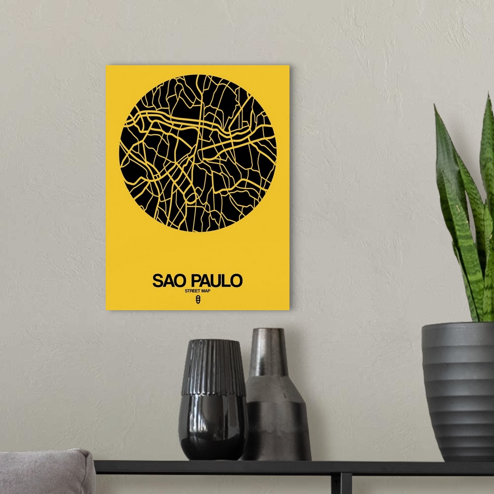 A modern room featuring Minimalist art map of the city streets of Sao Paulo in yellow and black.