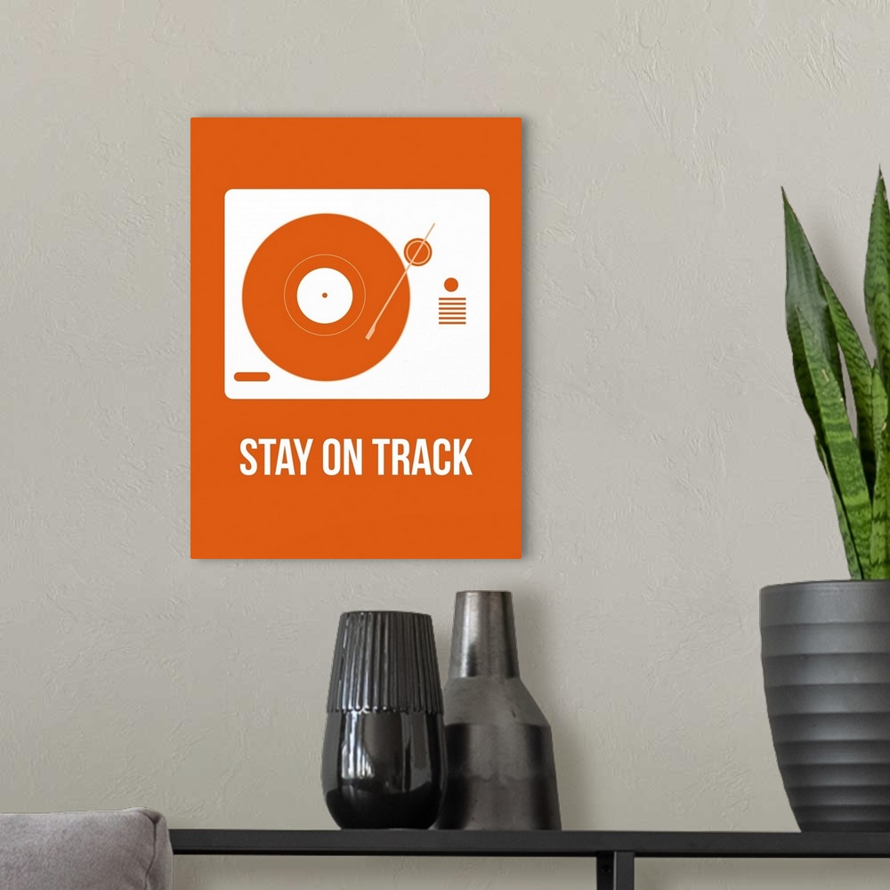 A modern room featuring Stay On Track Orange Poster