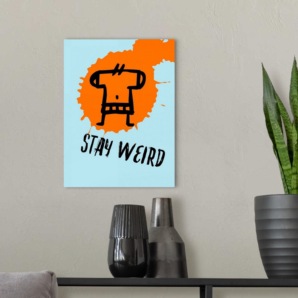 A modern room featuring Stay Weird Poster I