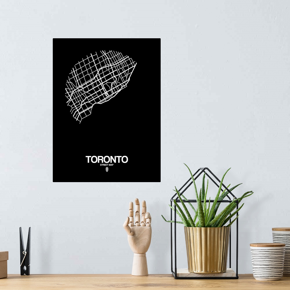 A bohemian room featuring Minimalist art map of the city streets of Toronto in black and white.