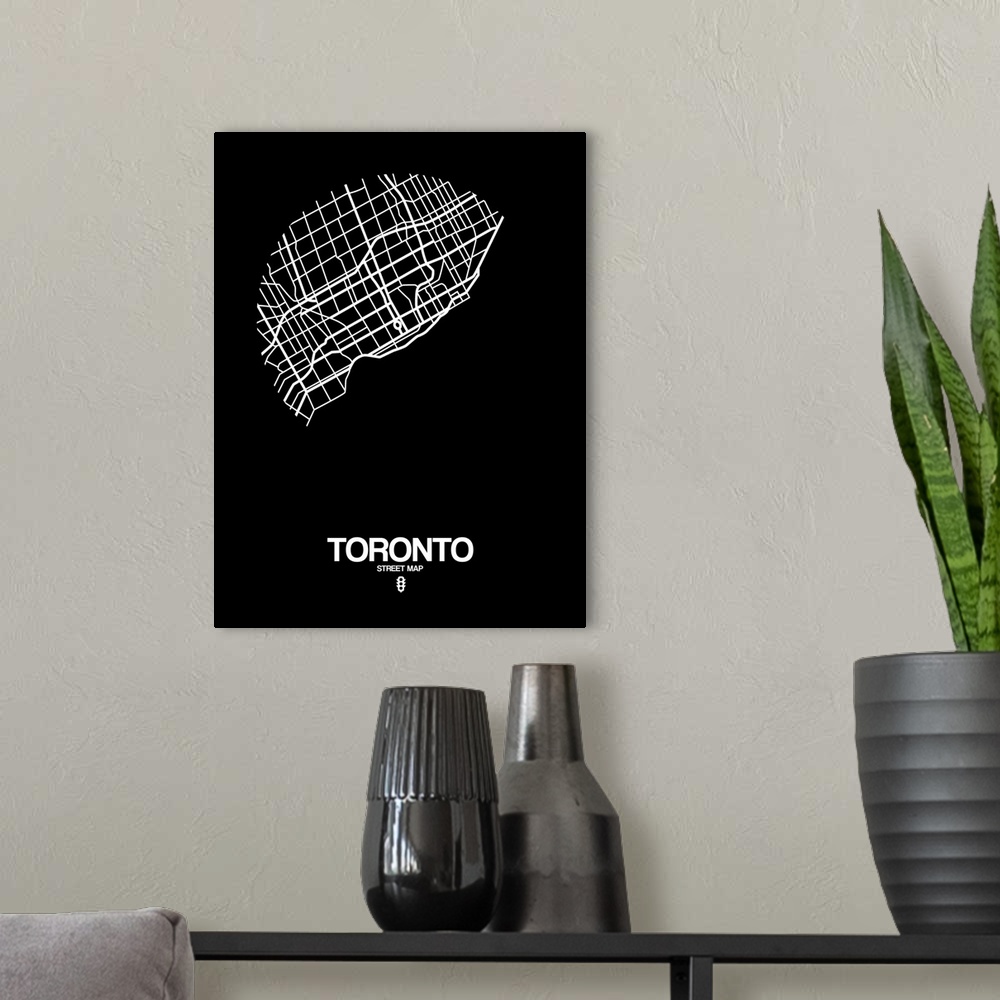 A modern room featuring Minimalist art map of the city streets of Toronto in black and white.