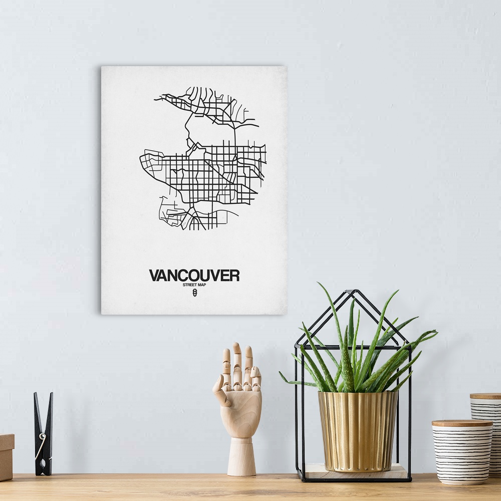 A bohemian room featuring Minimalist art map of the city streets of Vancouver in white and black.