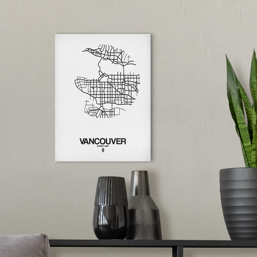 A modern room featuring Minimalist art map of the city streets of Vancouver in white and black.