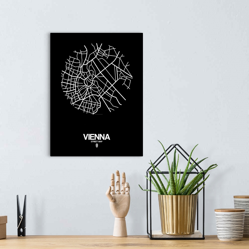 A bohemian room featuring Minimalist art map of the city streets of Vienna in black and white.