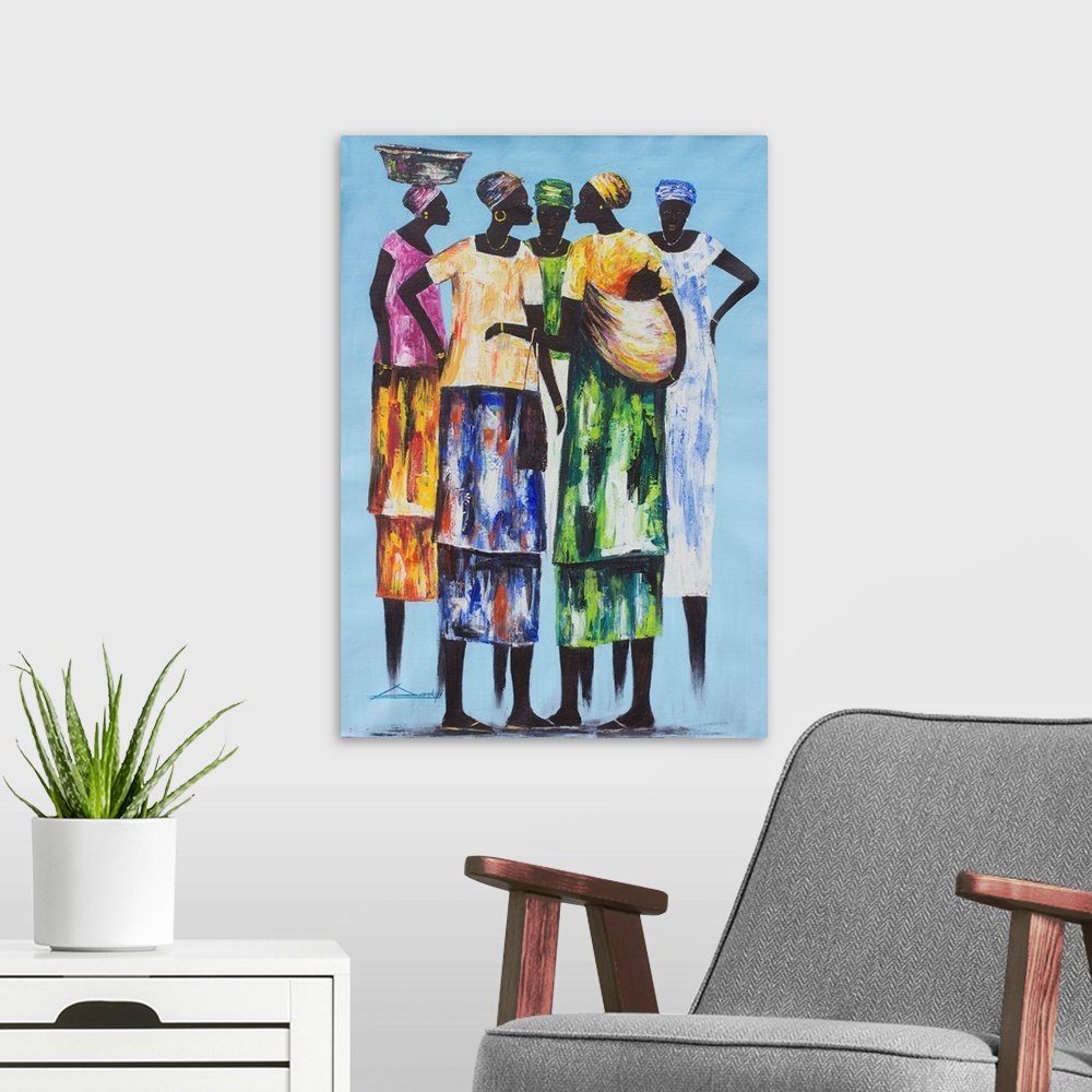 A modern room featuring Colorfully dressed in traditional attire, five women enjoy a spirited chat. They take time out of...