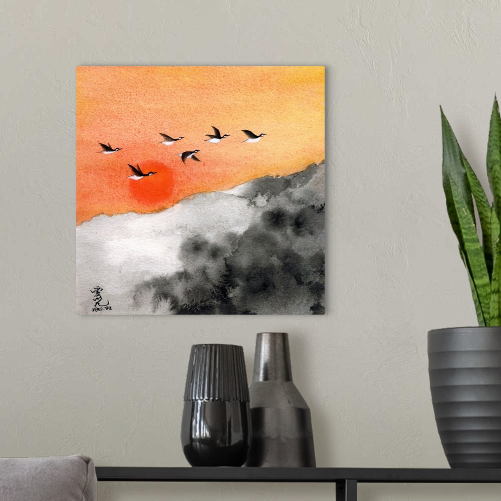 A modern room featuring Square painting of a warm sunset with birds flying through and a black and white landscape below.