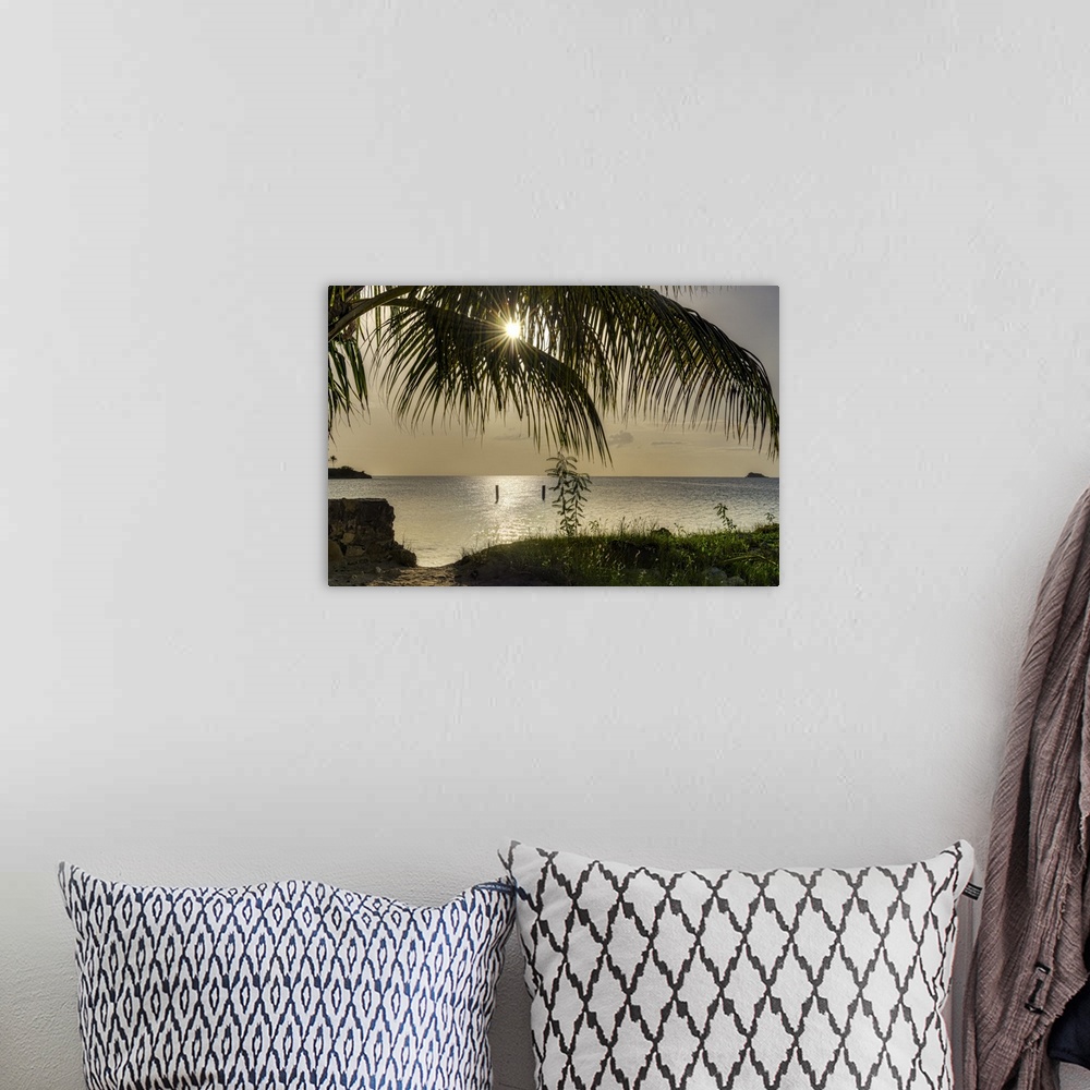 A bohemian room featuring Vibrant photograph of a beautiful sunset from the shore of Antigua.