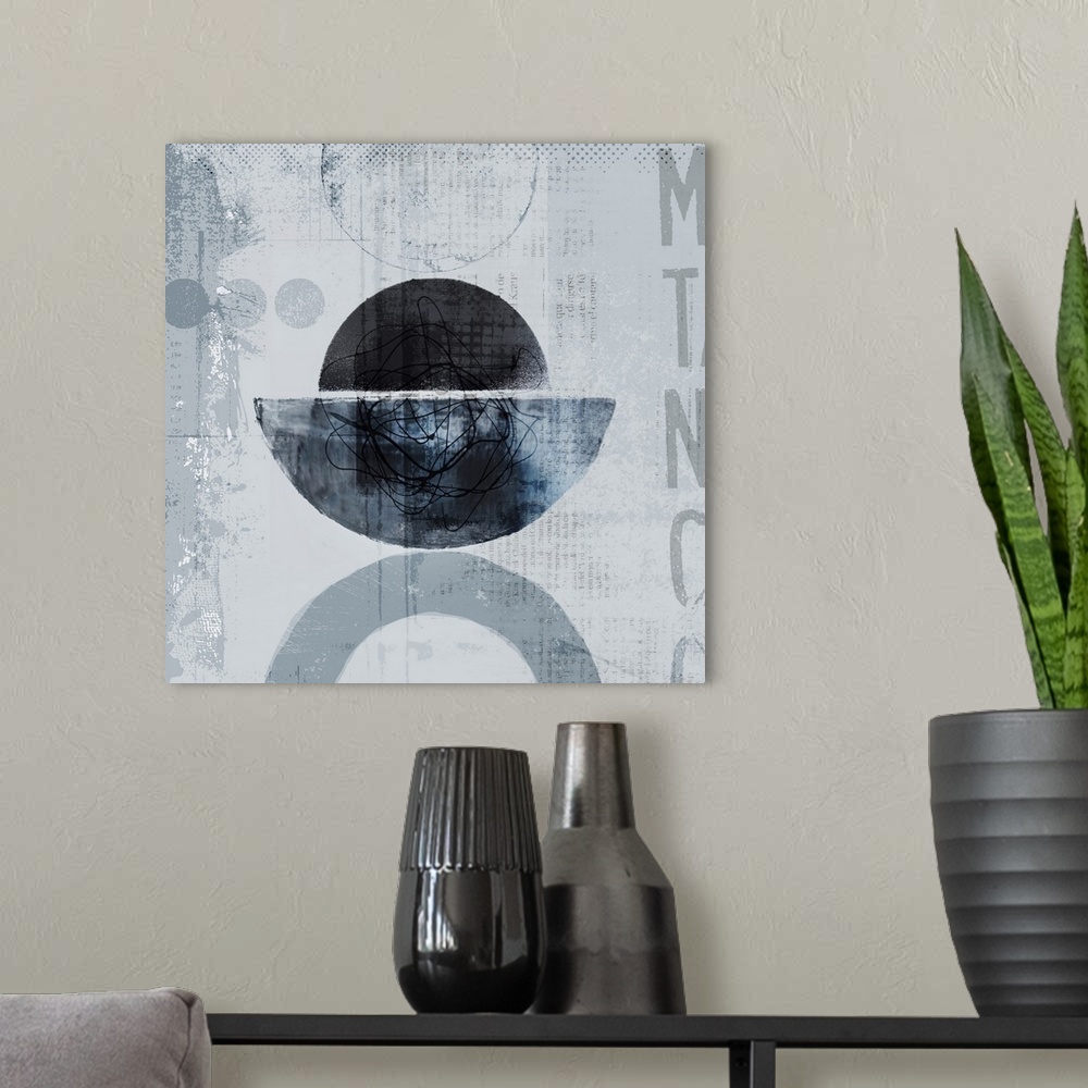 A modern room featuring Modern abstaract mixed media art in shades of blue and grey.