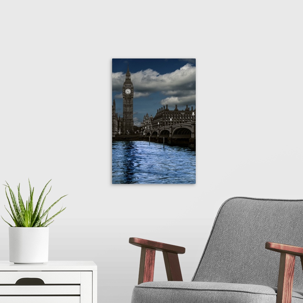 A modern room featuring A photograph of Big Ben across the river Thames in London at night.
