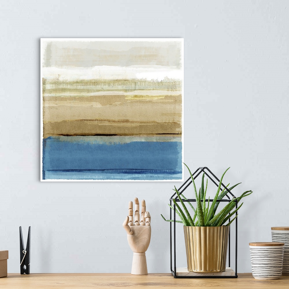 A bohemian room featuring Vibrant blue and brown modern abstract seascape painting.