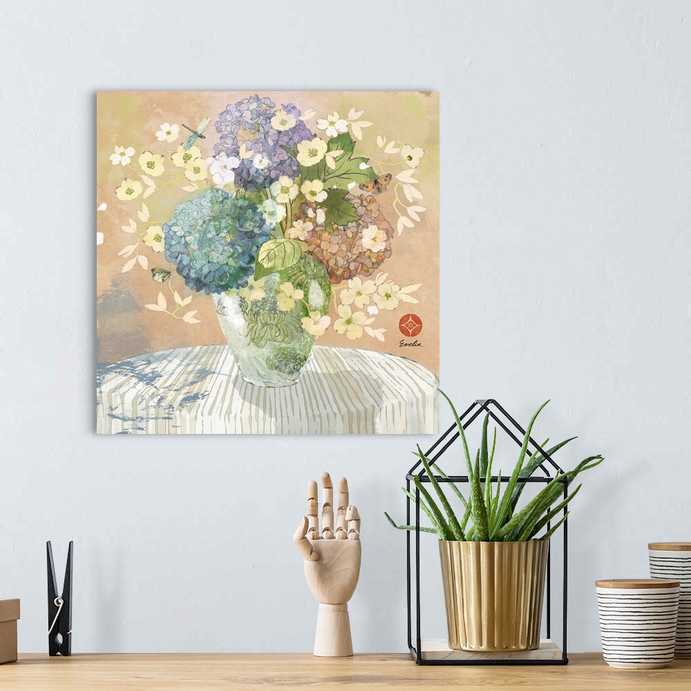 A bohemian room featuring Artwork of beautiful flowers in a vase on a table.