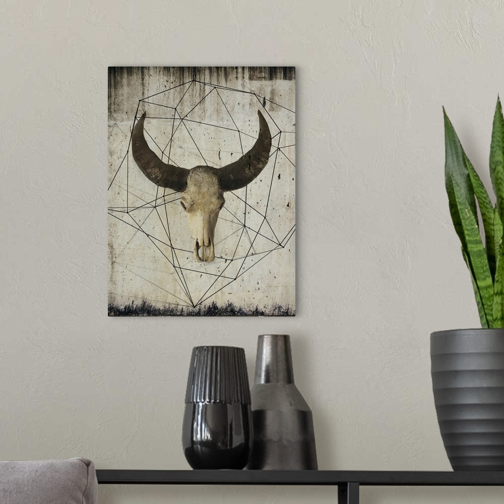 A modern room featuring Painting of a bison skull with large dark horns, embellished with geometric lines on a grungy bac...