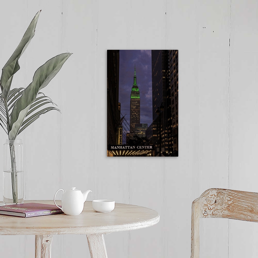 A farmhouse room featuring A photograph of the Empire State Building with a green top at sunset.