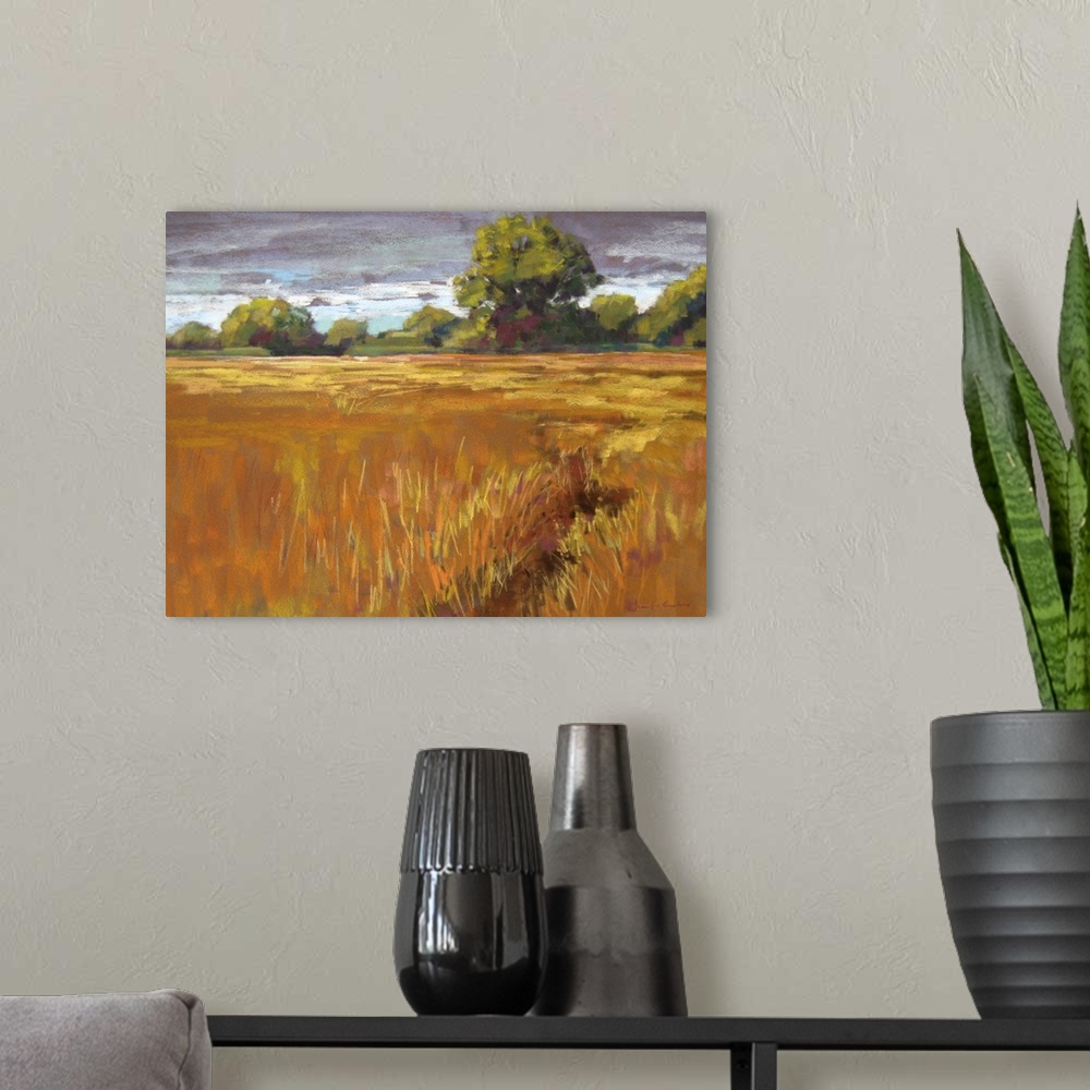 A modern room featuring Contemporary painting of golden field of grass in the countryside.