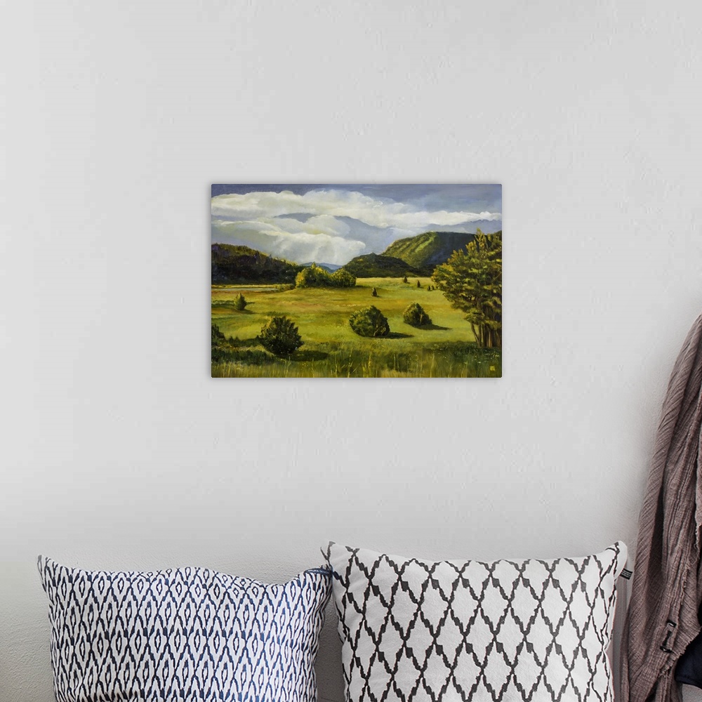A bohemian room featuring Contemporary painting of an idyllic countryside landscape.