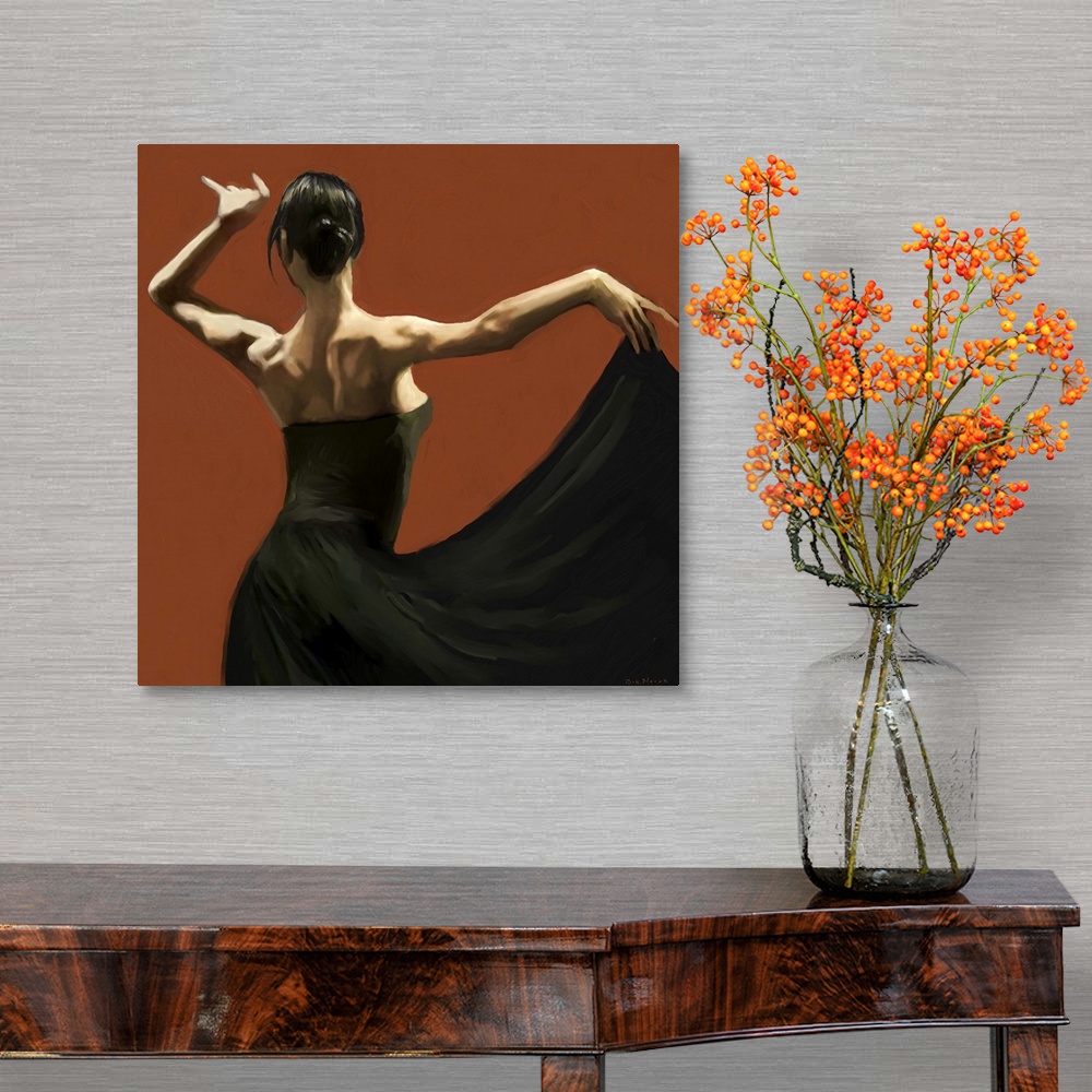 A traditional room featuring Dramatic lighting on the shoulders of a female Flamenco dancer in a long black dress against deep...