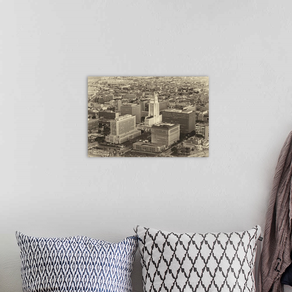 A bohemian room featuring Aerial vintage photograph of the downtown LA area.