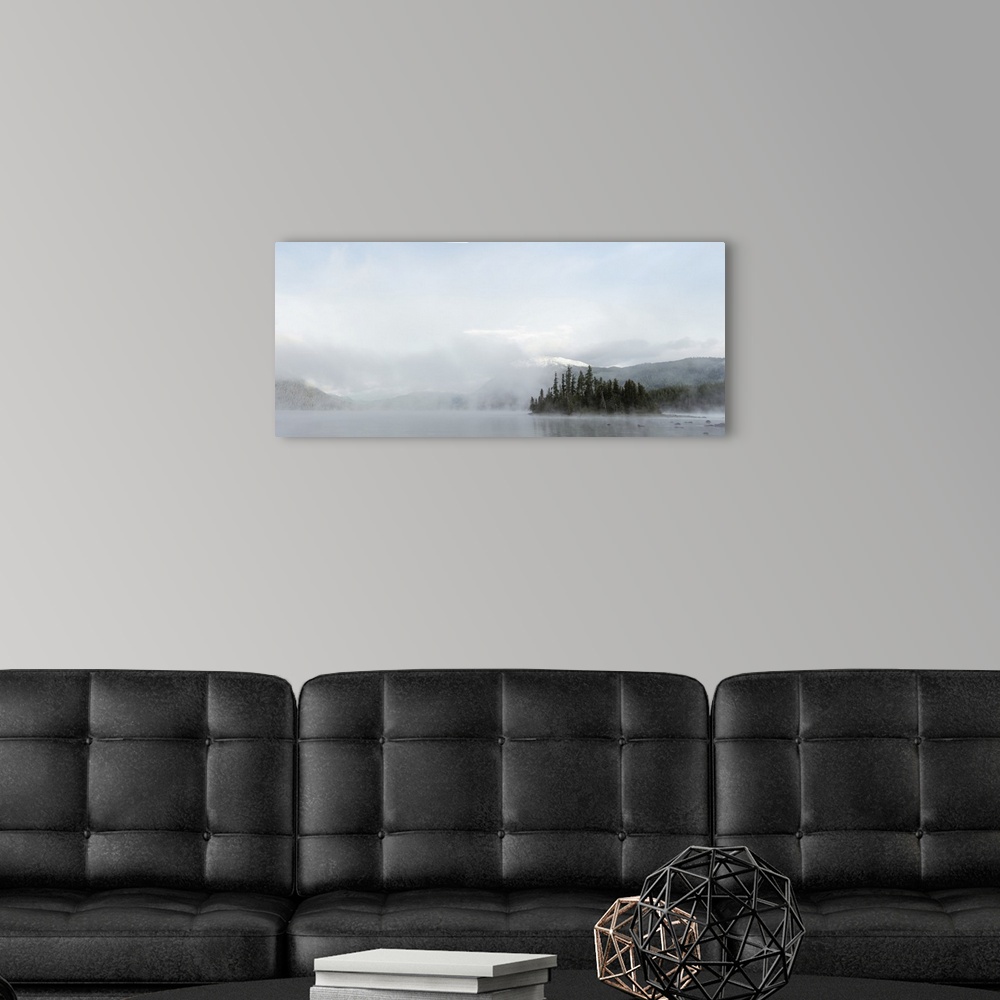 A modern room featuring Early morning mist rises off of Lake Wenatchee on an autumn morning near Leavenworth, Washington.