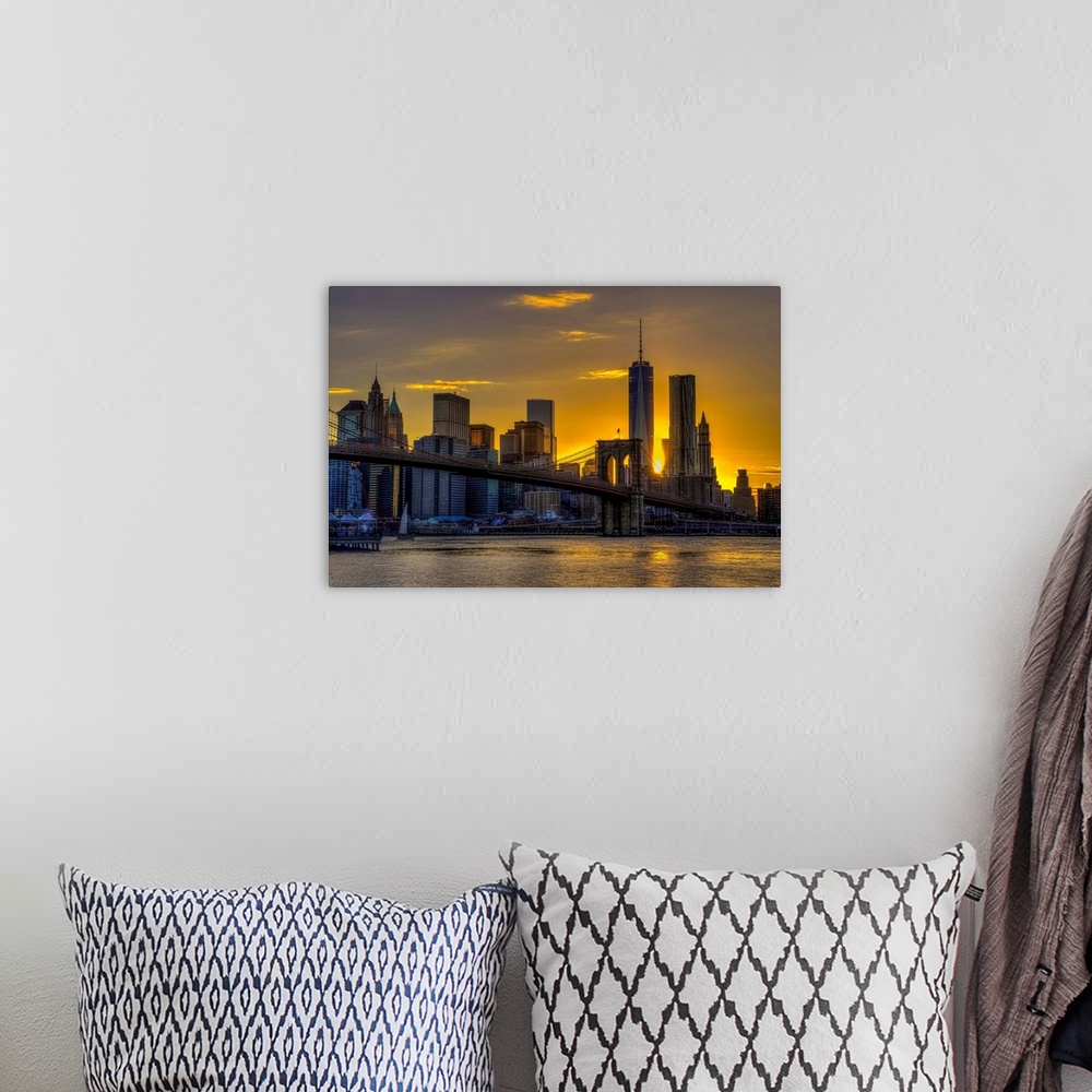 A bohemian room featuring A photograph of the NYC skyline at sunset.