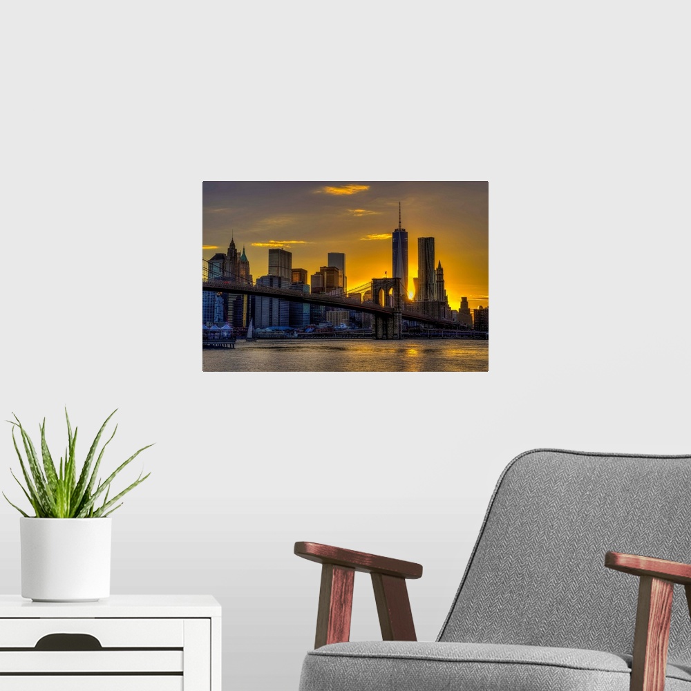 A modern room featuring A photograph of the NYC skyline at sunset.