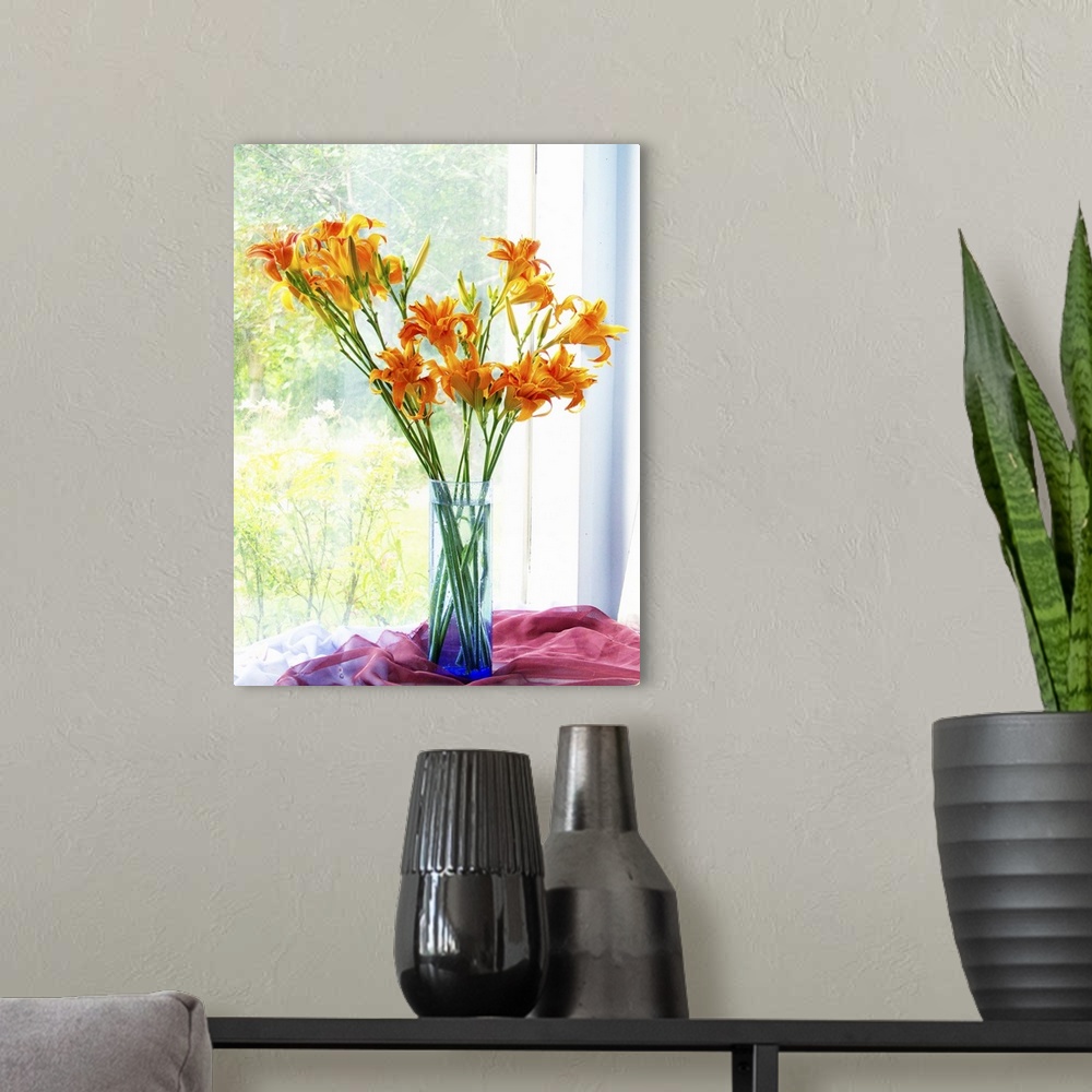 A modern room featuring Orange Daylily Bouquet