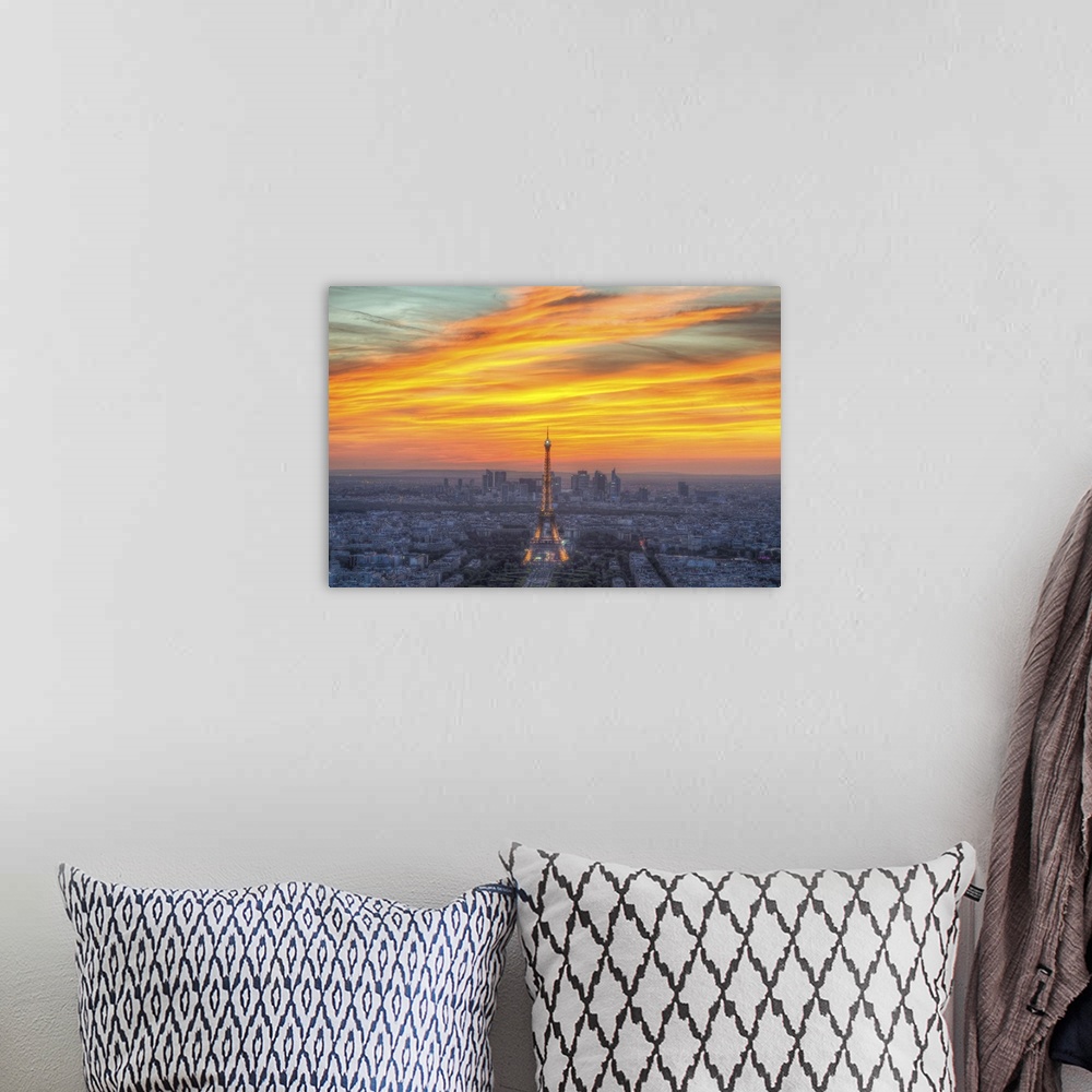 A bohemian room featuring Vibrant photograph of the Eiffel tower standing tall in the center of Paris during sunset.