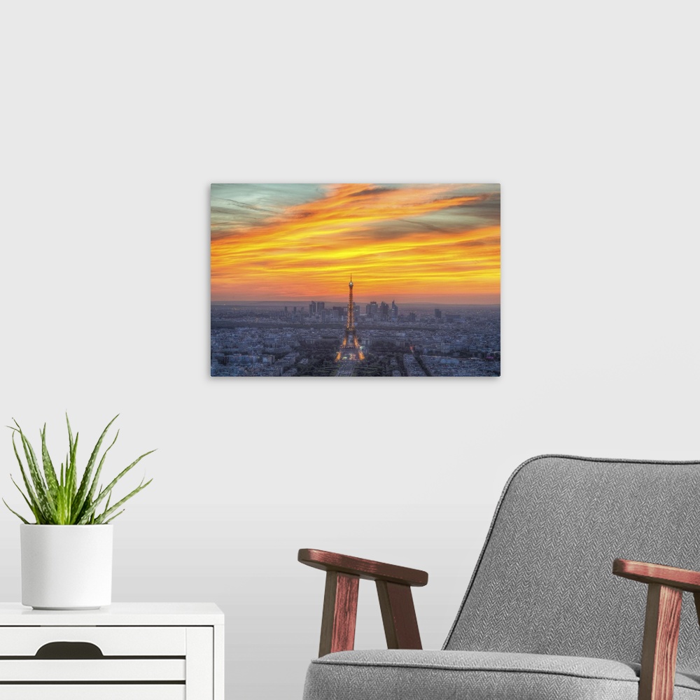 A modern room featuring Vibrant photograph of the Eiffel tower standing tall in the center of Paris during sunset.