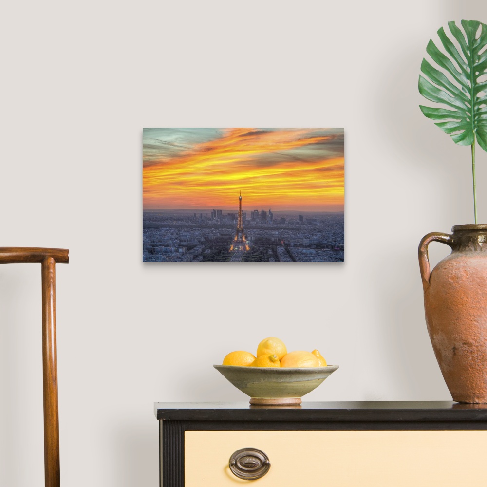 A traditional room featuring Vibrant photograph of the Eiffel tower standing tall in the center of Paris during sunset.