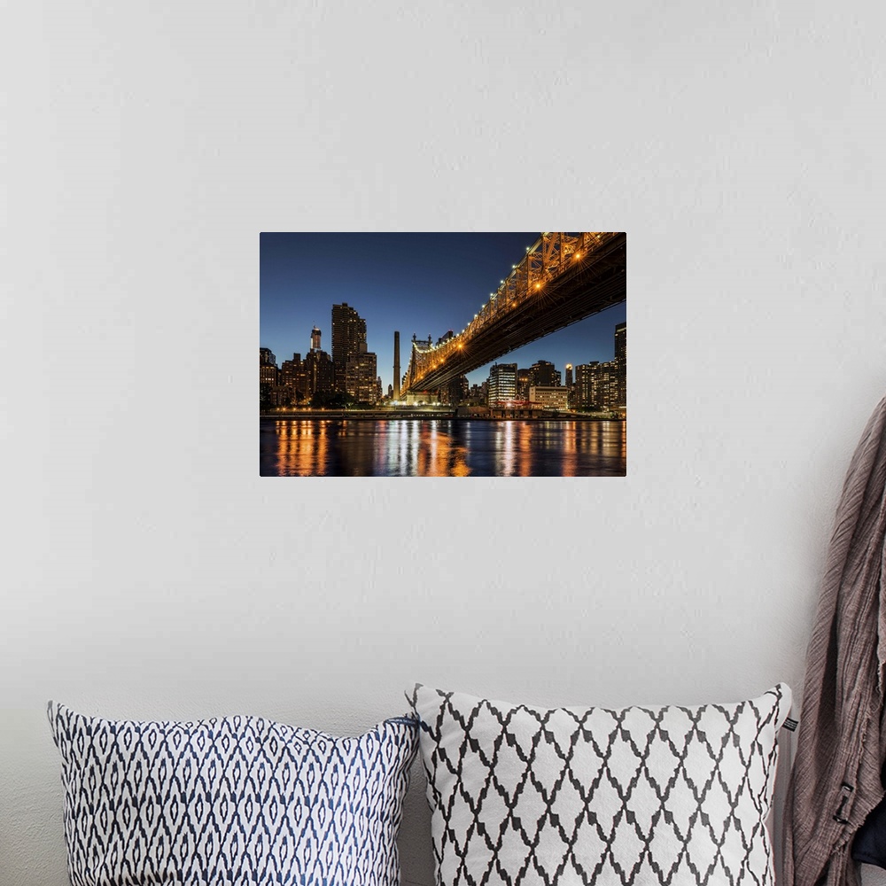 A bohemian room featuring A photograph of the Queensboro bridge at night.