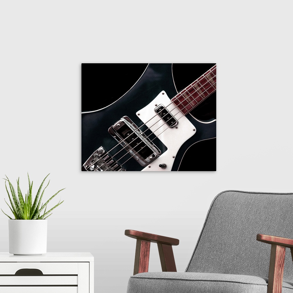 A modern room featuring Close-up photograph of an electric guitar.