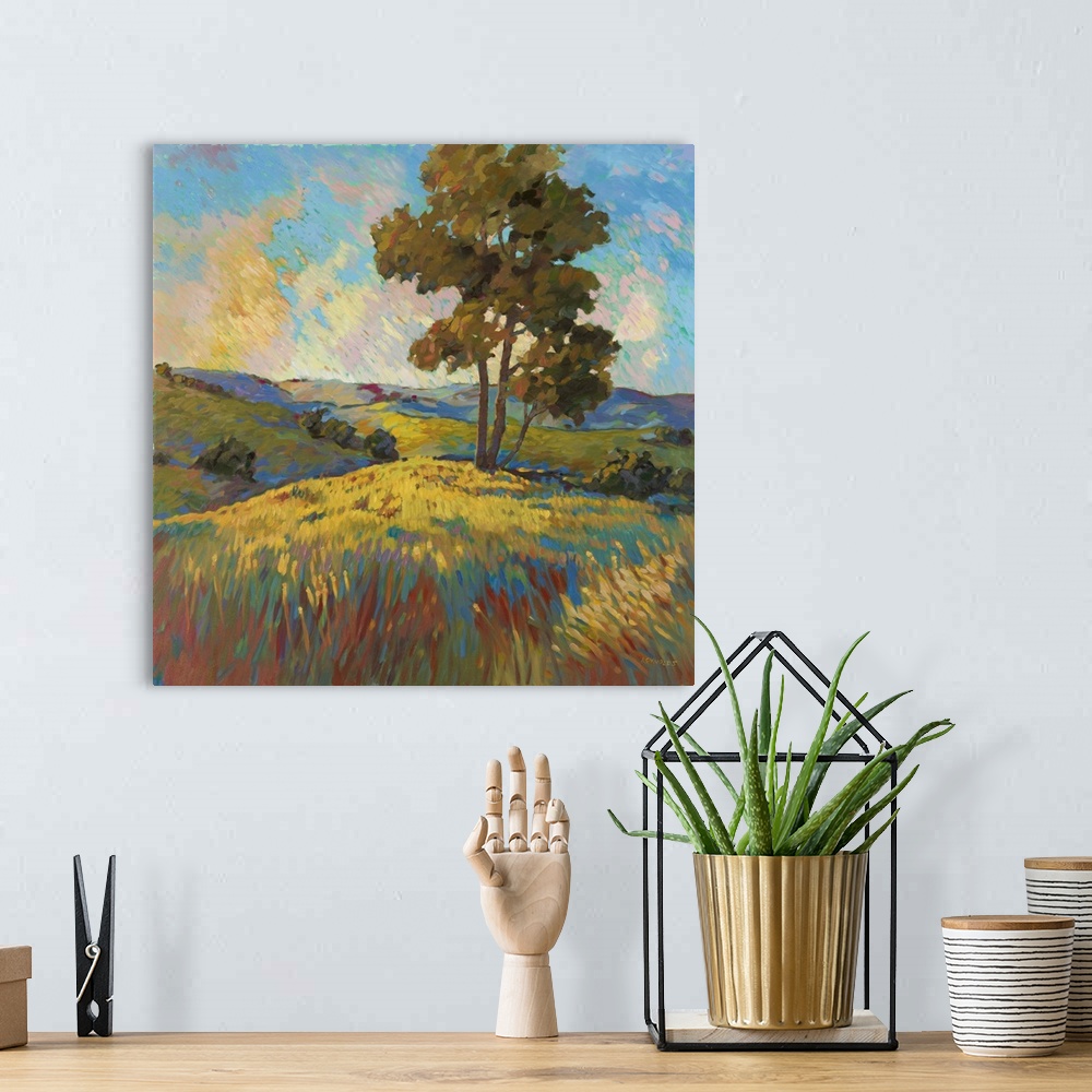 A bohemian room featuring Contemporary landscape painting of a tree standing over a field at sunset.