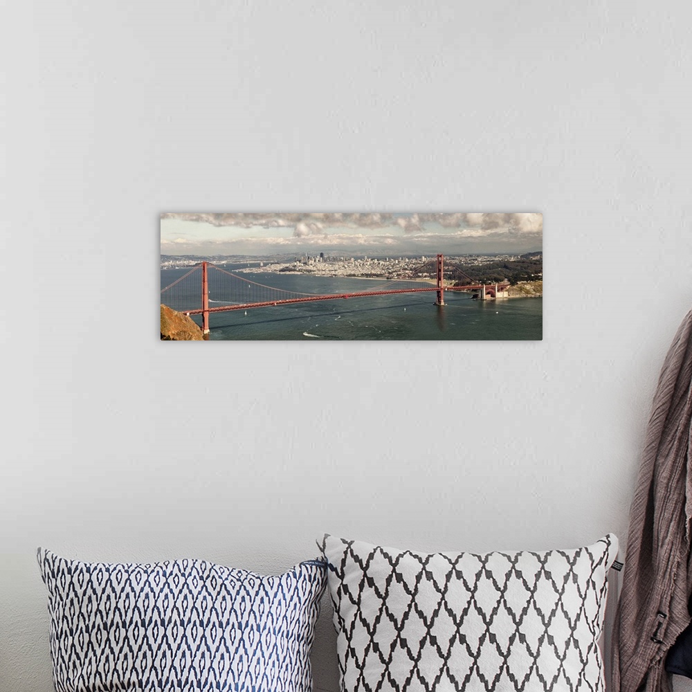 A bohemian room featuring Panoramic photograph of the Golden Gate Bridge in San Francisco bay.