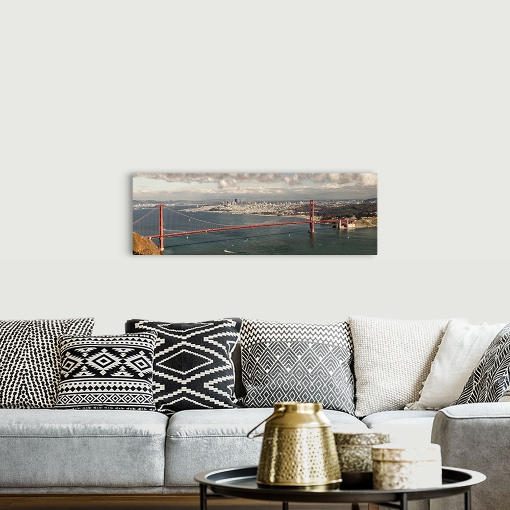 A bohemian room featuring Panoramic photograph of the Golden Gate Bridge in San Francisco bay.