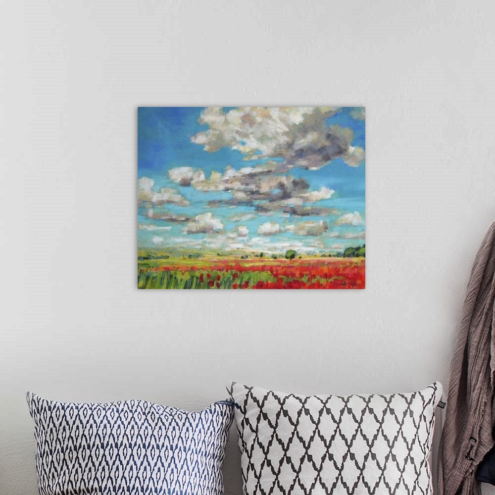 A bohemian room featuring Hovering clouds and an endless field of poppies hanging on a wall gives any room depth and vibrancy.