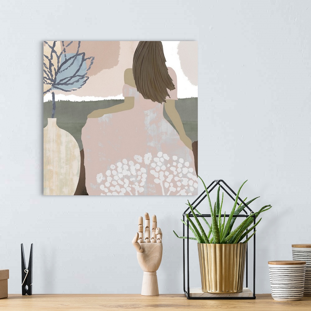 A bohemian room featuring Pastel abstract figurative painting of woman in a pink flowing floral dress.
