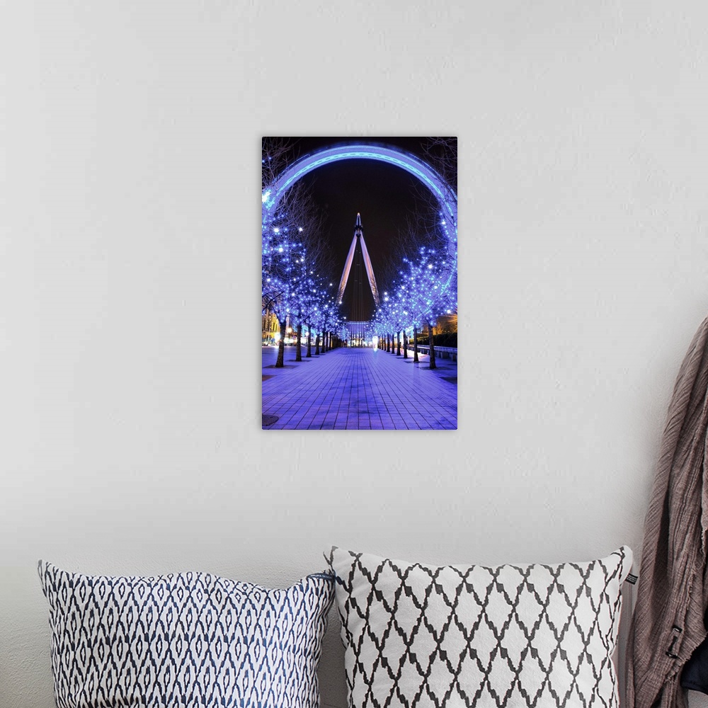 A bohemian room featuring A photograph of the London Eye from a long aisle of blue lit up trees for Christmas.