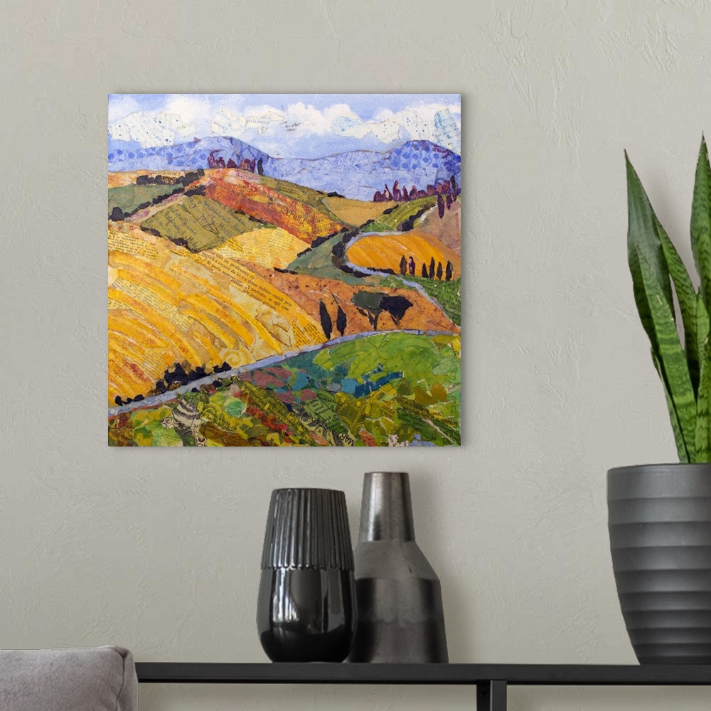 A modern room featuring Tuscan landscape with yellow rolling hills, purple mountains, and winding road.