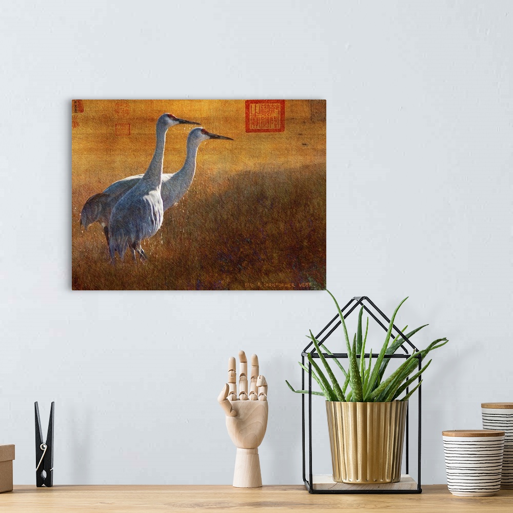 A bohemian room featuring Contemporary artwork of cranes standing together.