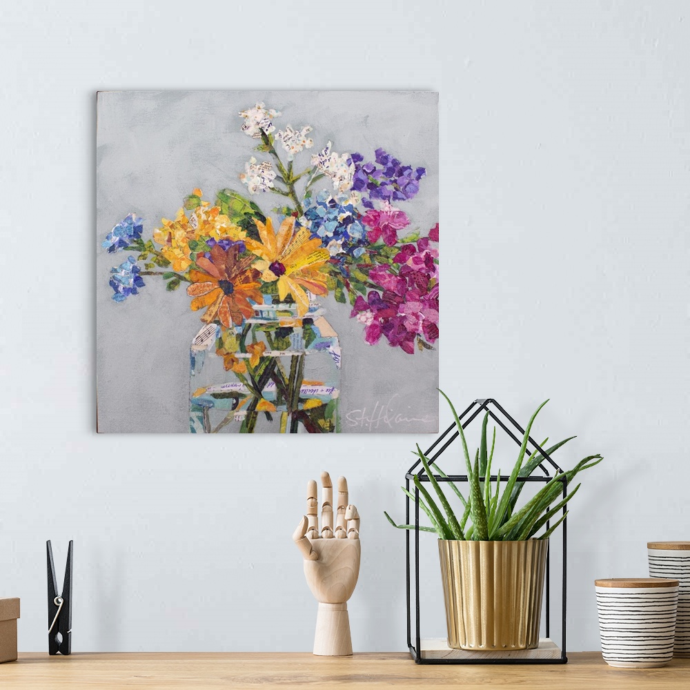 A bohemian room featuring Mixed media collage of wildflowers of yellow, pink, purple, and white in a clear glass jar.