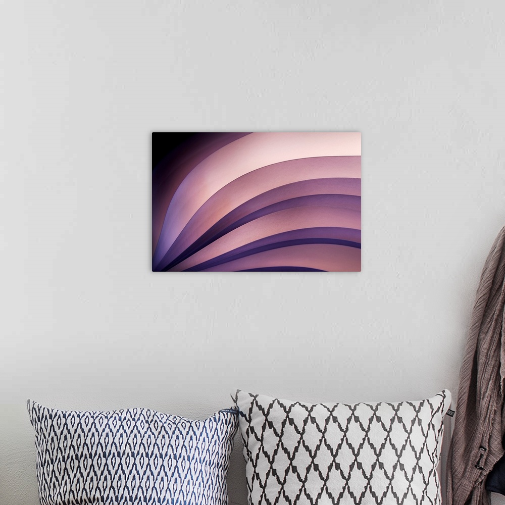 A bohemian room featuring Waves and curves of different shaded purples are used in this abstract piece.