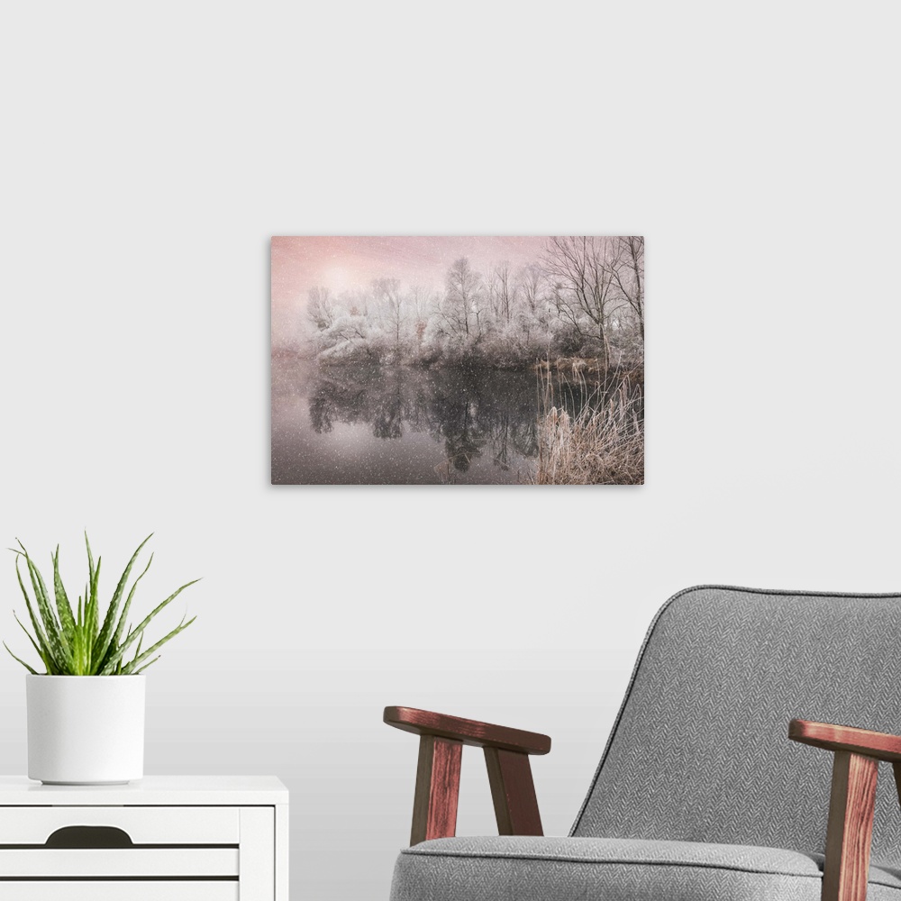 A modern room featuring Magenta toned dreamy photograph of snowfall over a calm lake surrounded by winter trees.