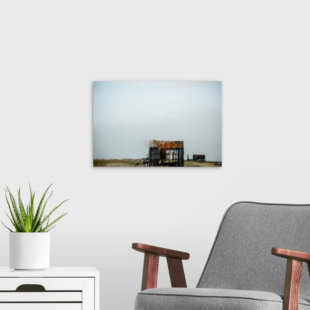 A modern room featuring Conceptual photograph of abandoned shacks in the middle of no where with a clear sky full of nega...