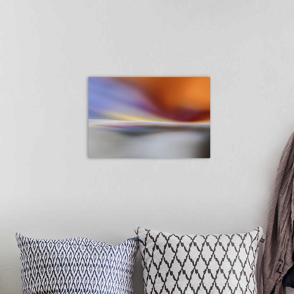 A bohemian room featuring Abstract representation of a sunset on a white beach.